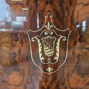 1950s mahogany sideboard with a glass top and central bar.