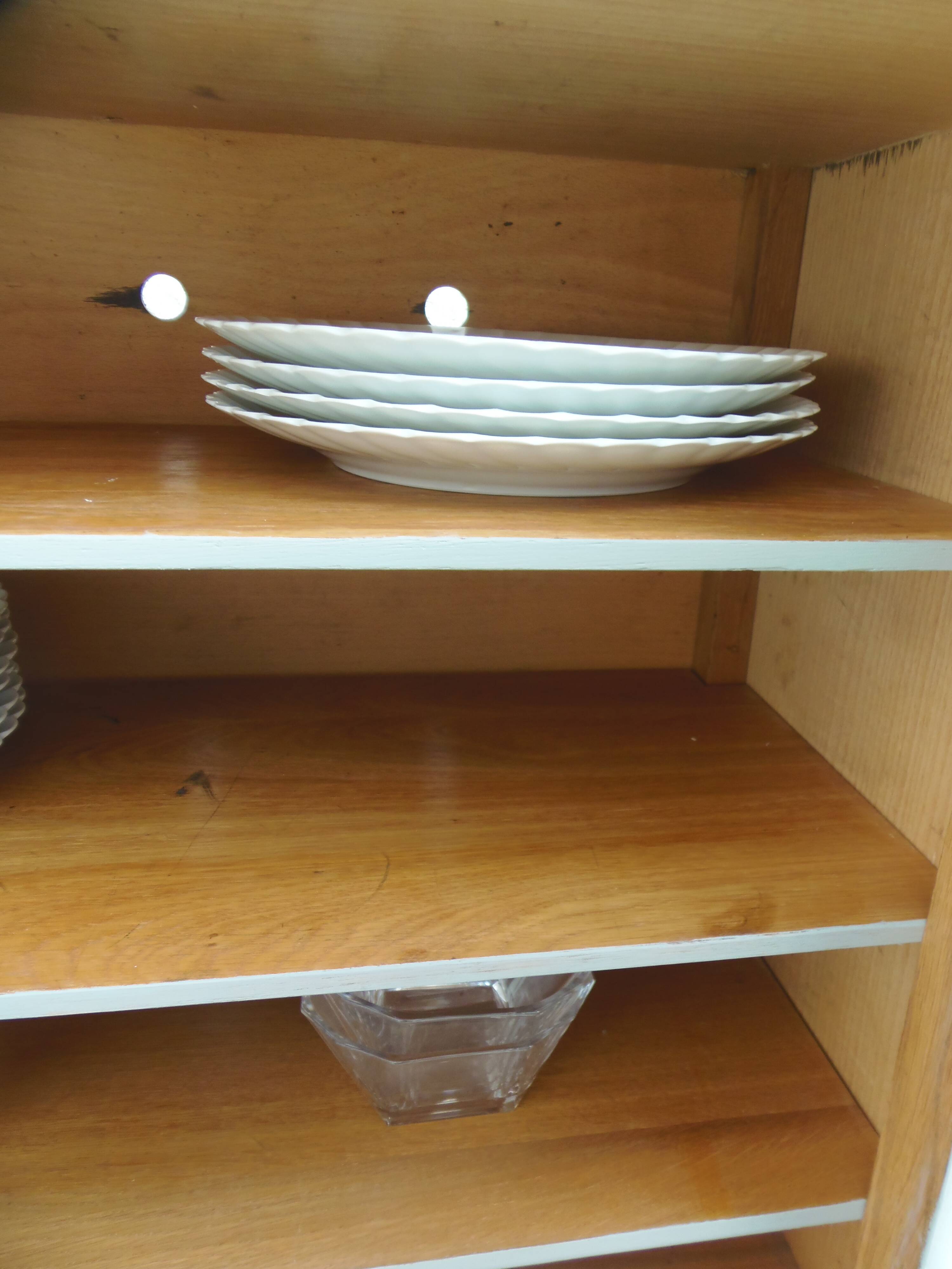 Small vintage piece of furniture with a shallow depth, re-enchanted in grey-green.