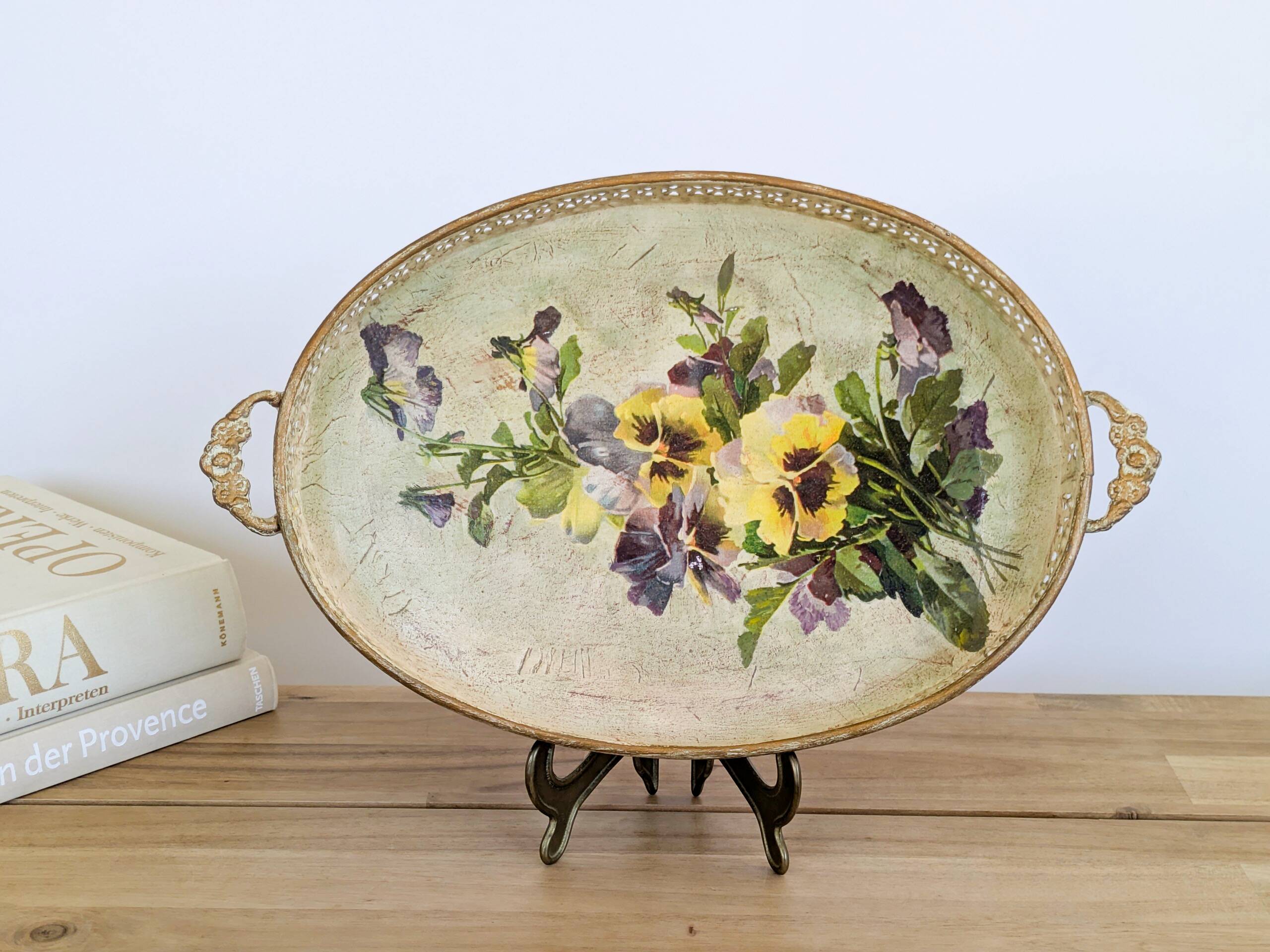 Oval metal decorative vintage tray with floral pattern.