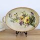Oval metal decorative vintage tray with floral pattern.