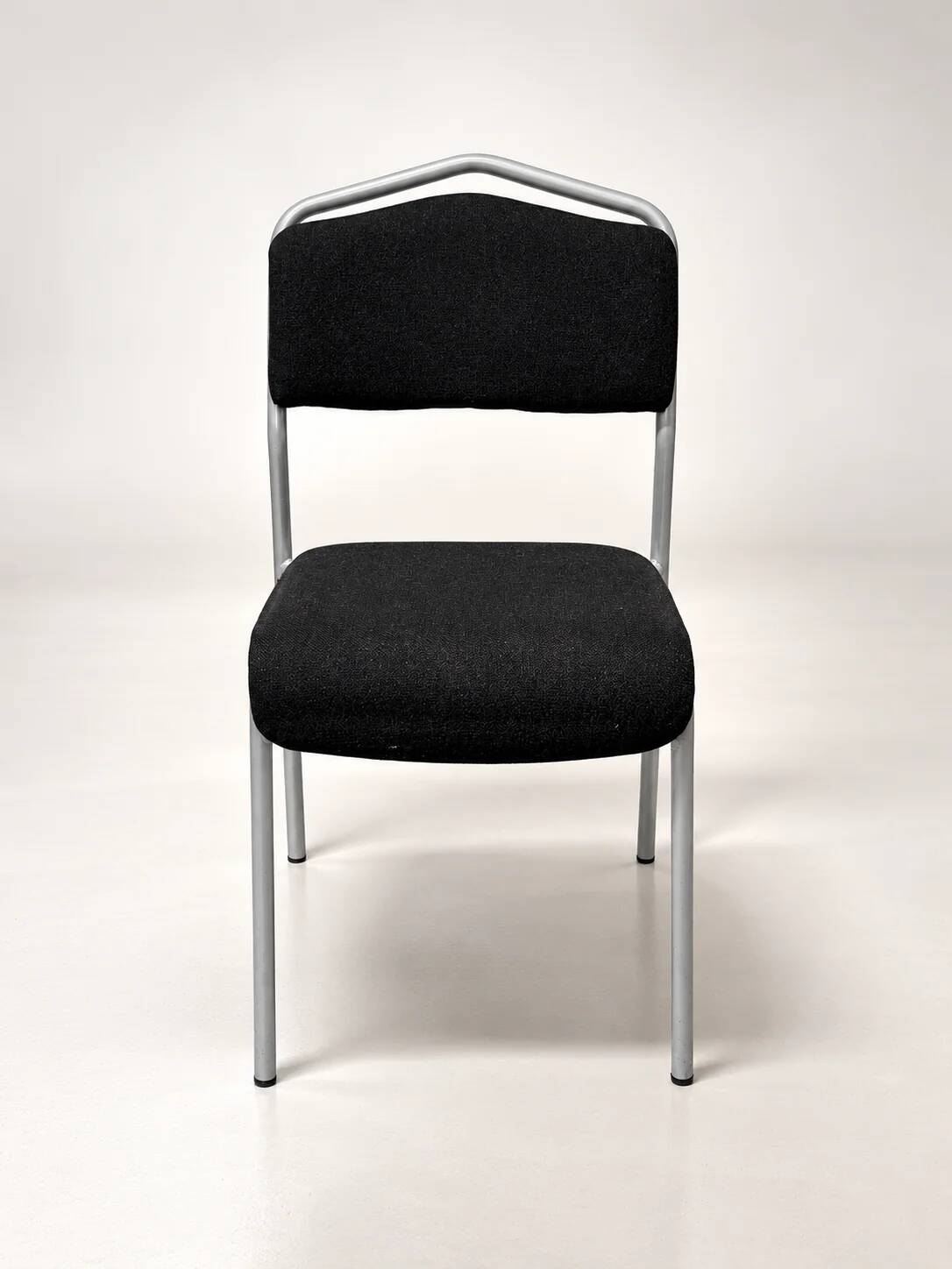 Grey steel chair and black fabric