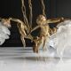 Vintage chandelier with cherubs and frosted glass flowers.