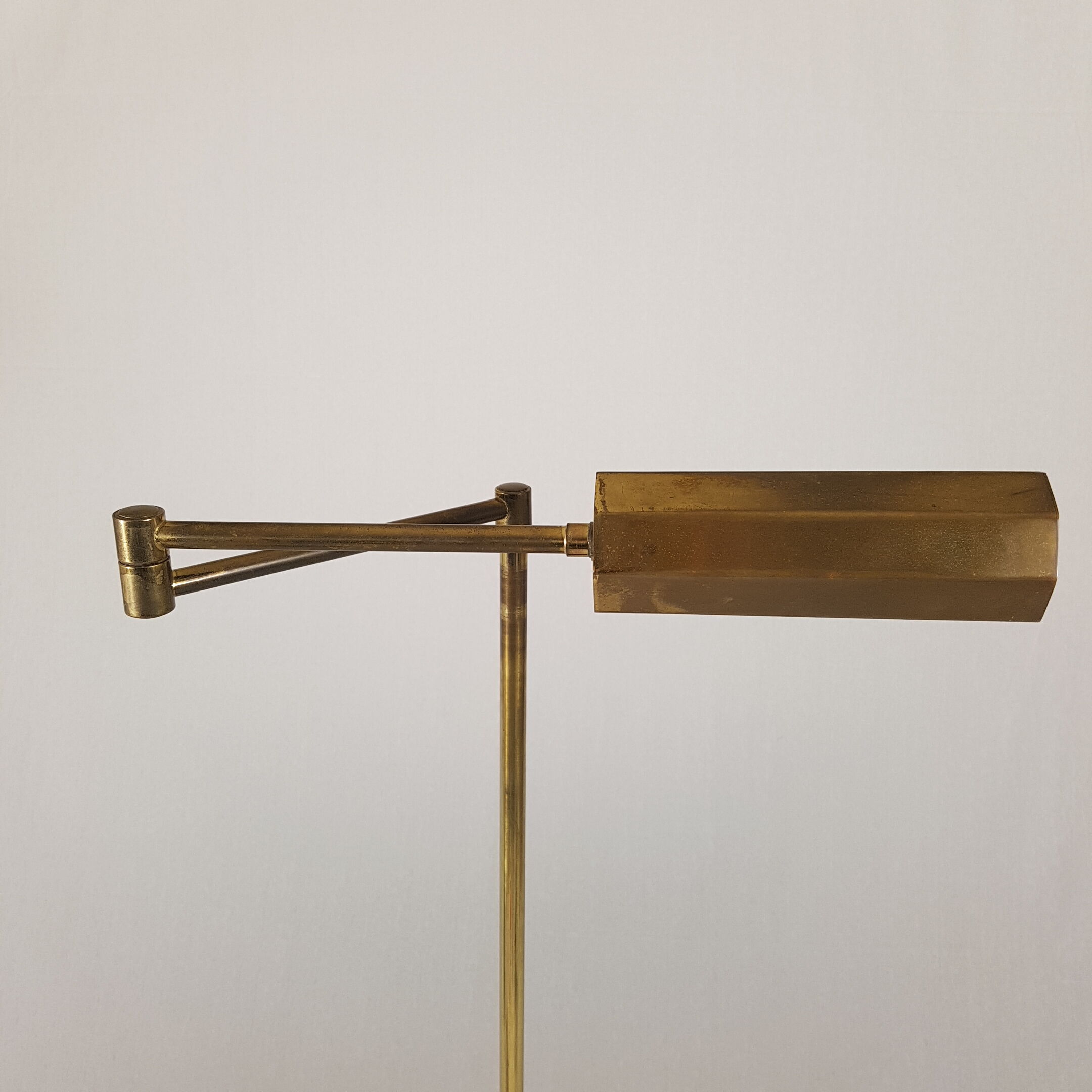 Articulated brass floor lamp