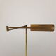 Articulated brass floor lamp