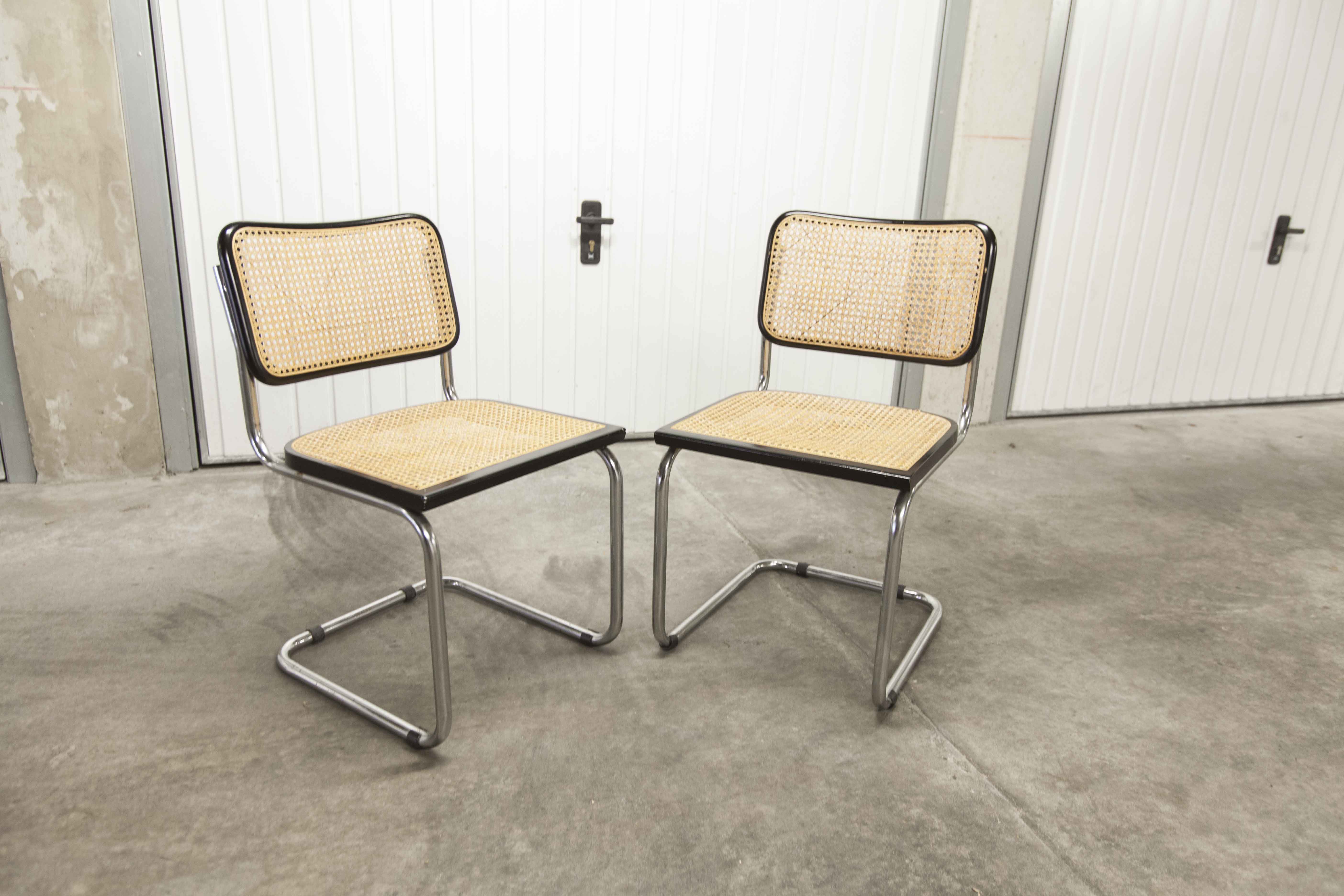 Pair of black Breuer b32 chairs and cannage