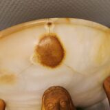 Wall lamp, where the base is a carved wooden lady holding the shade which is made of alabaster 1920s