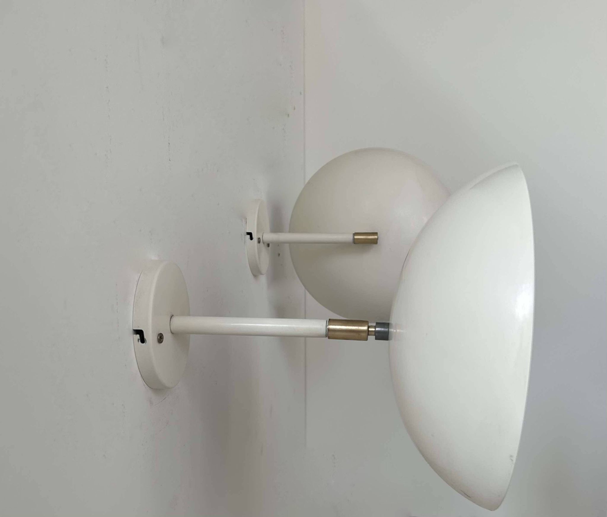 Pair of vintage adjustable wall lights, brass and white metal, France 1970