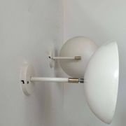 Pair of vintage adjustable wall lights, brass and white metal, France 1970