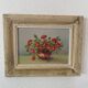 Oil painting red country flowers in a vase.