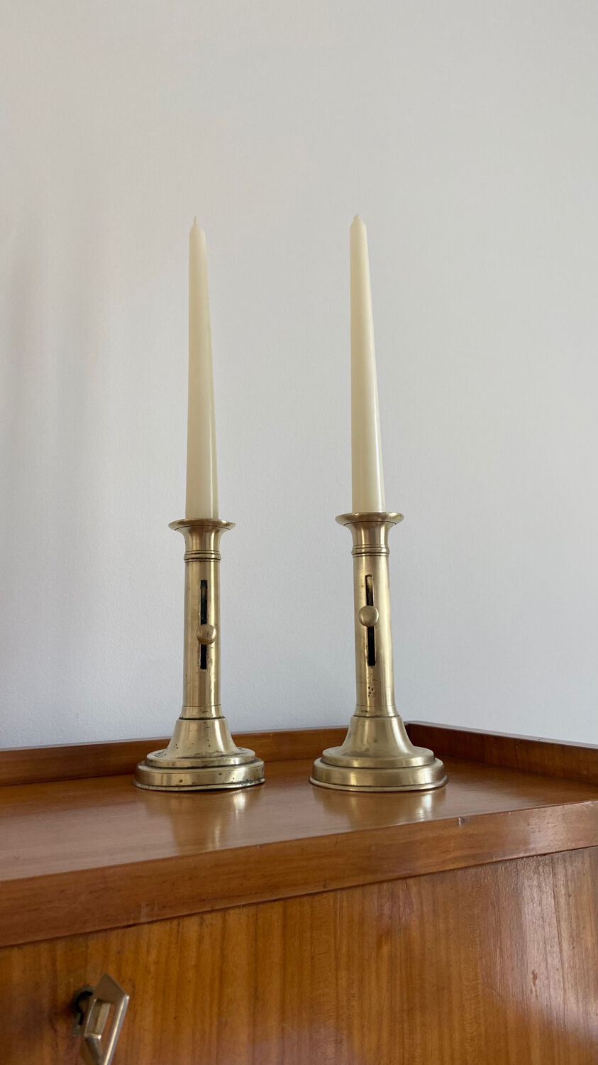 Pair of antique brass push candlesticks