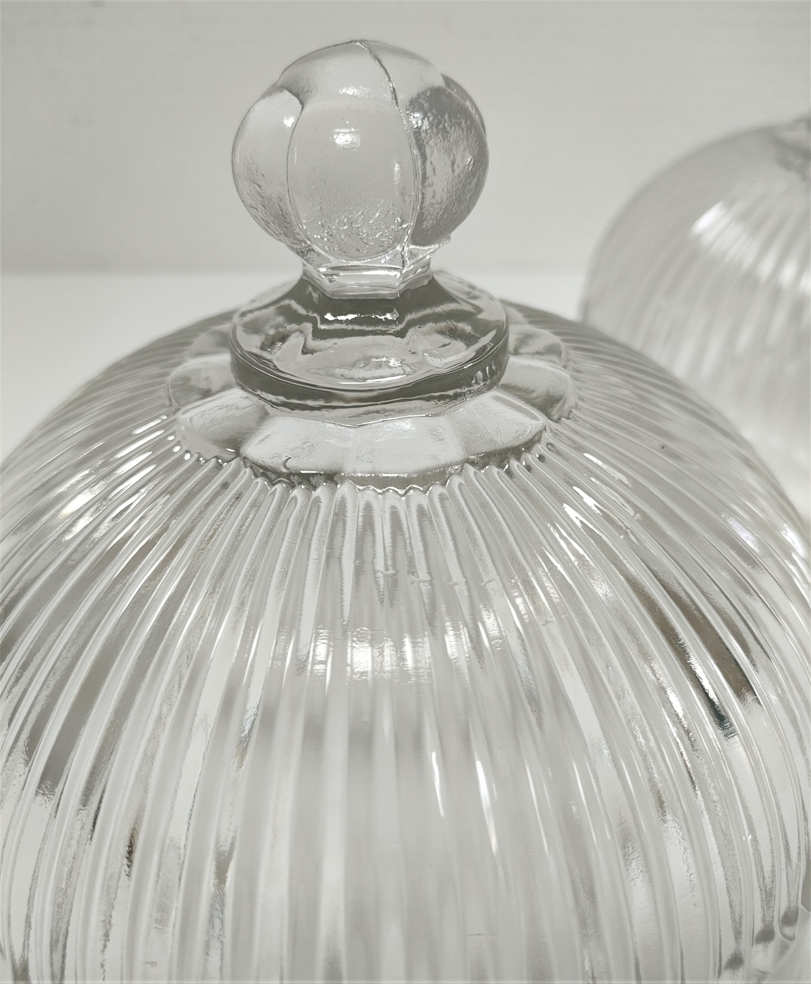 Two cheese bells molded pressed glass striated Art Deco style early twentieth century