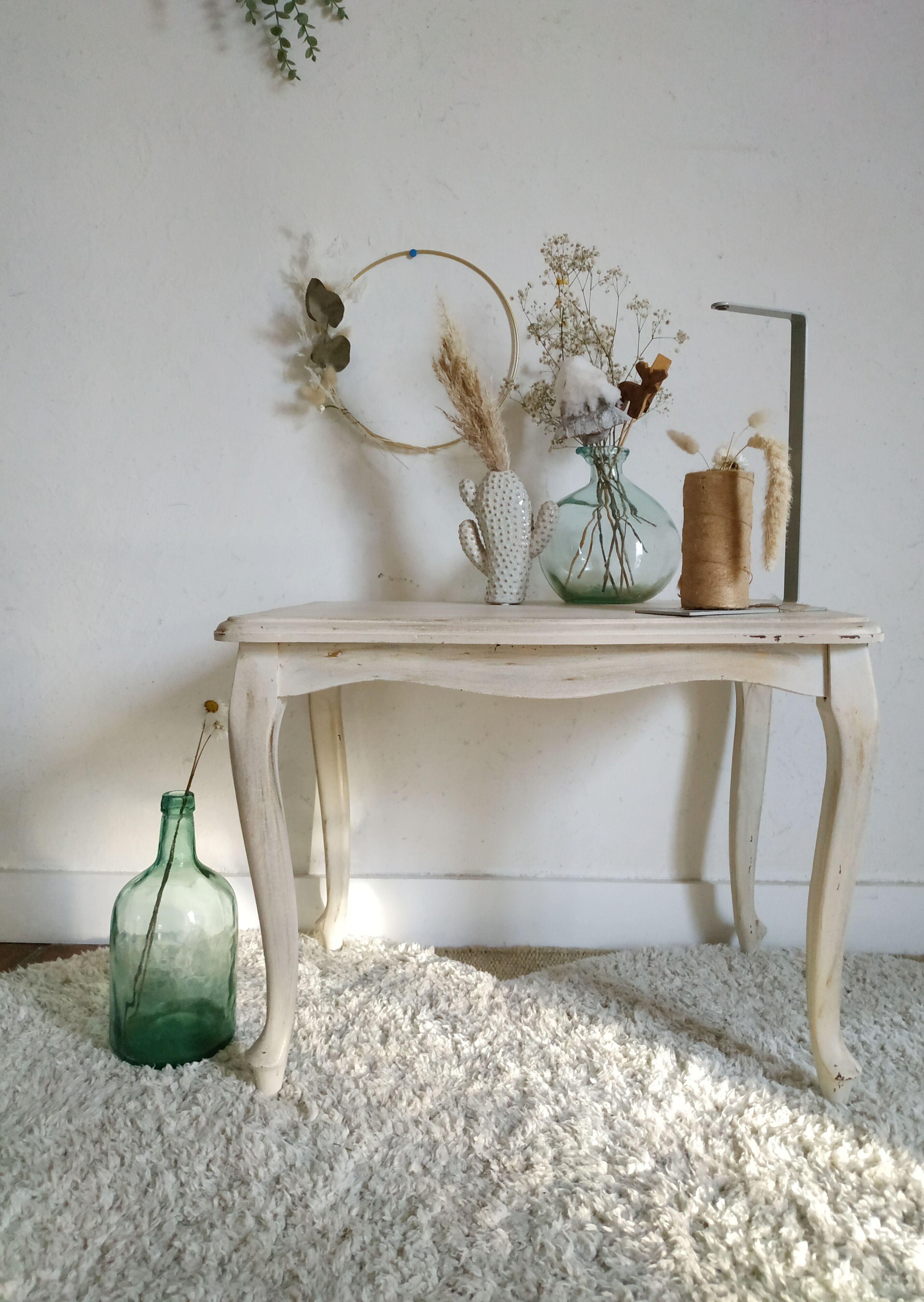 Old patinated coffee table and curved feet