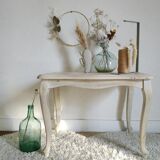 Old patinated coffee table and curved feet