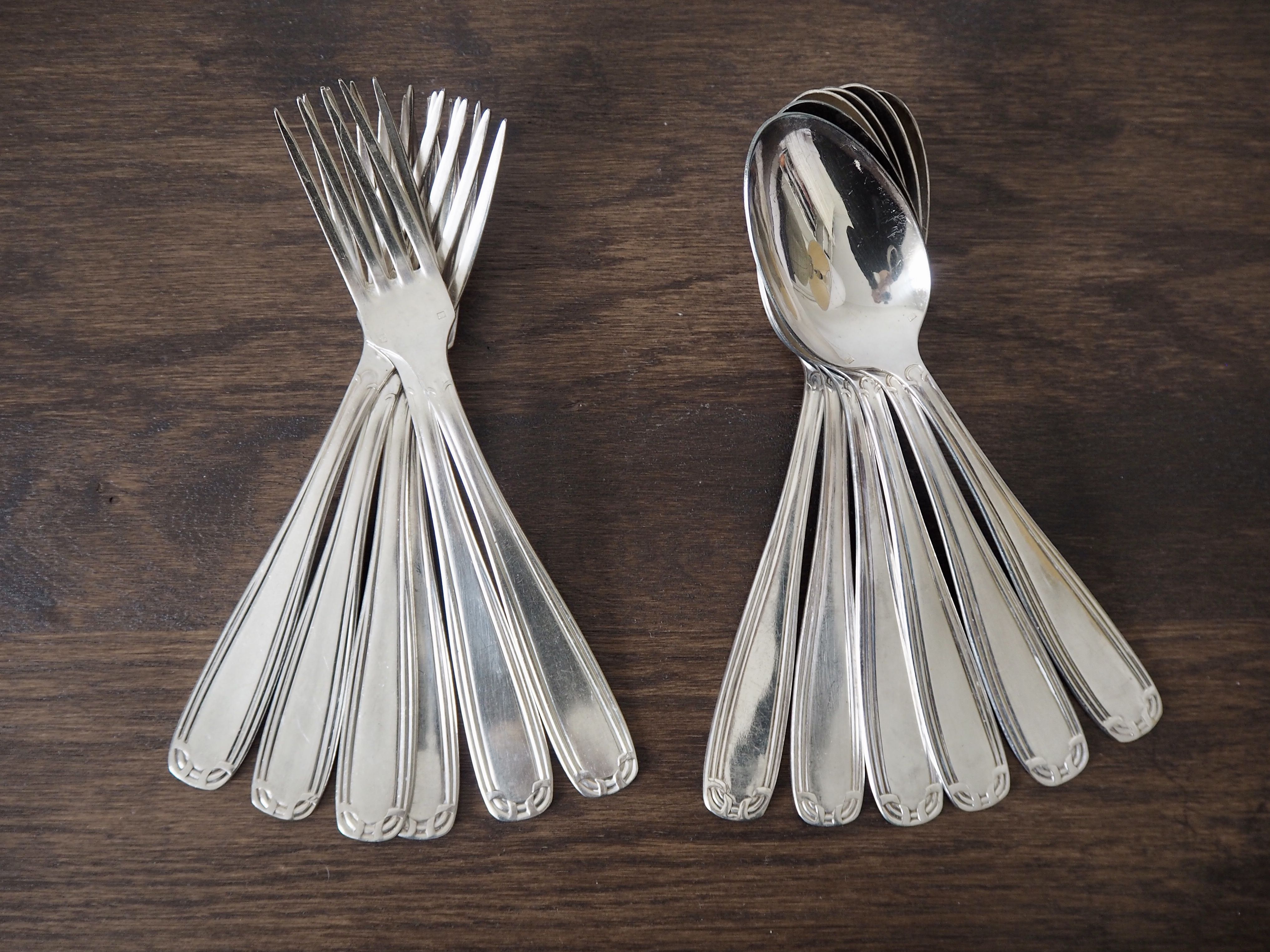 Set of 6 forks and 6 spoons in silver metal with punches