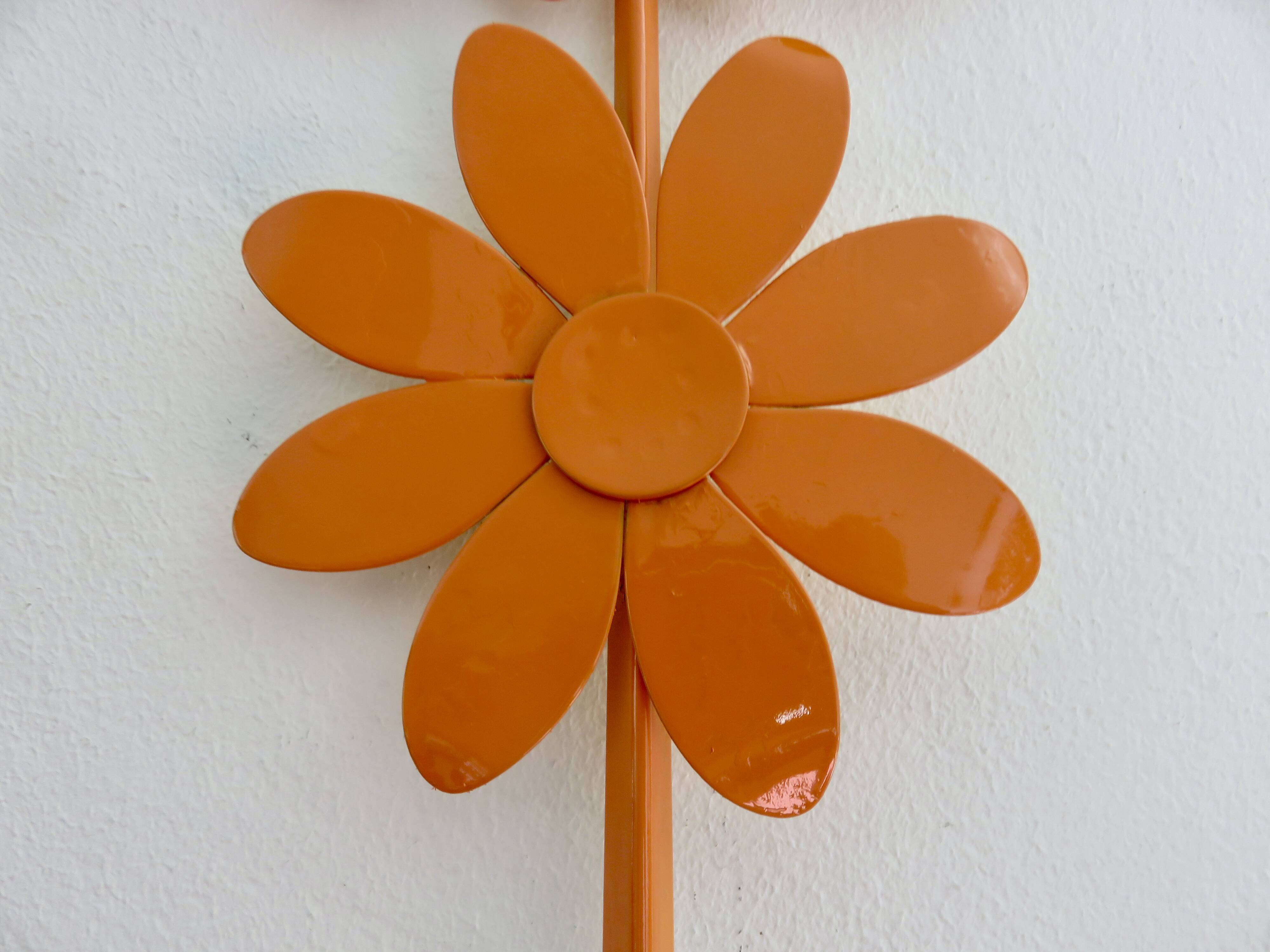 Large 1970s "flower" mirror in orange metal