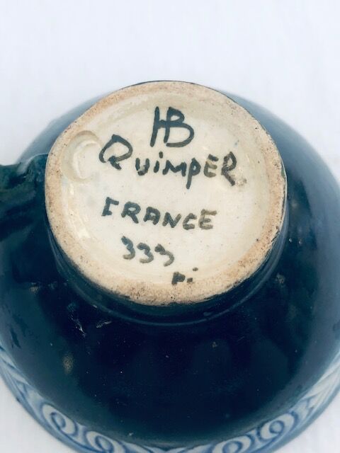 Two cups and two quimper milk jars