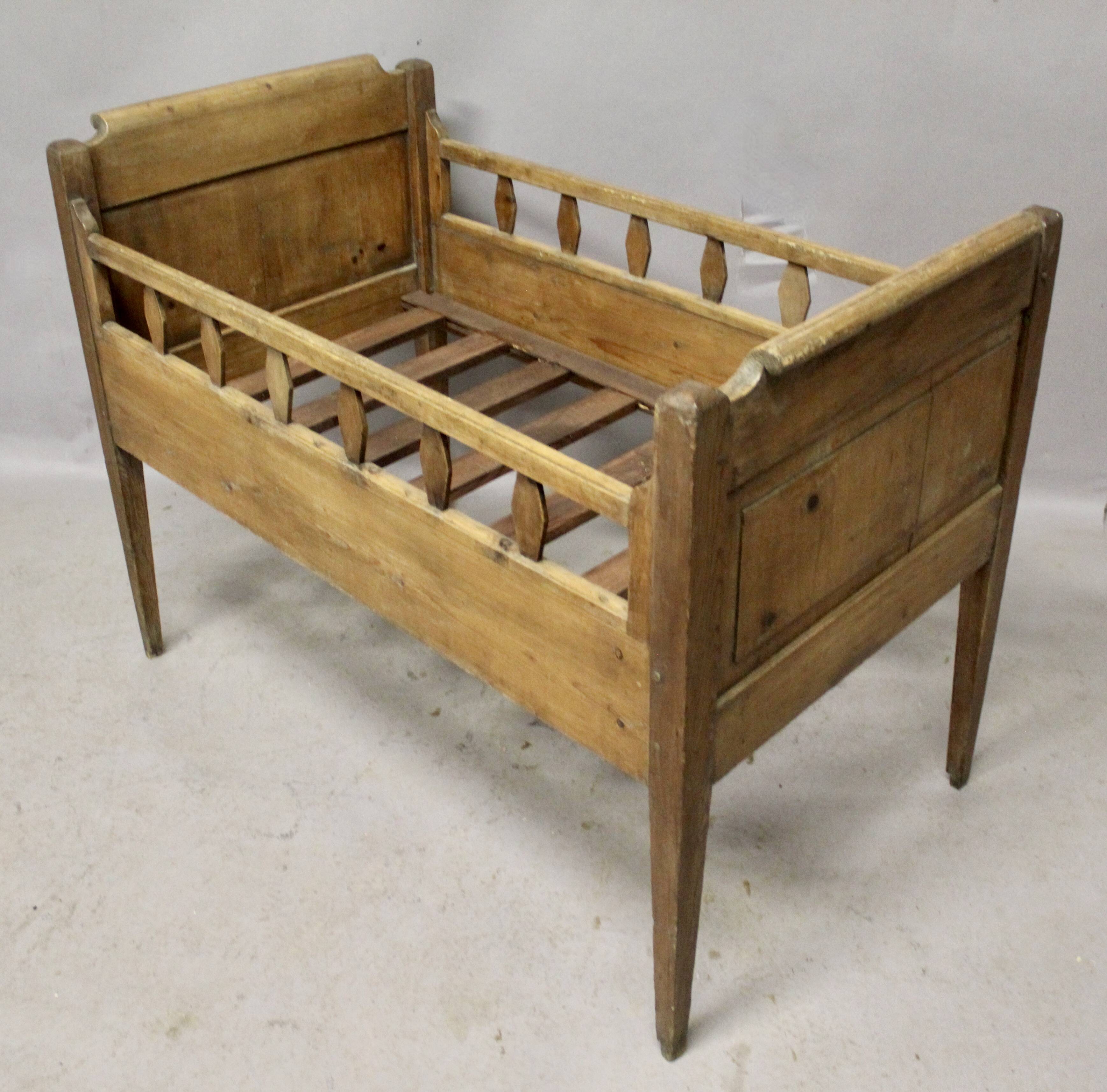 Antique children's bed from the 19th century.