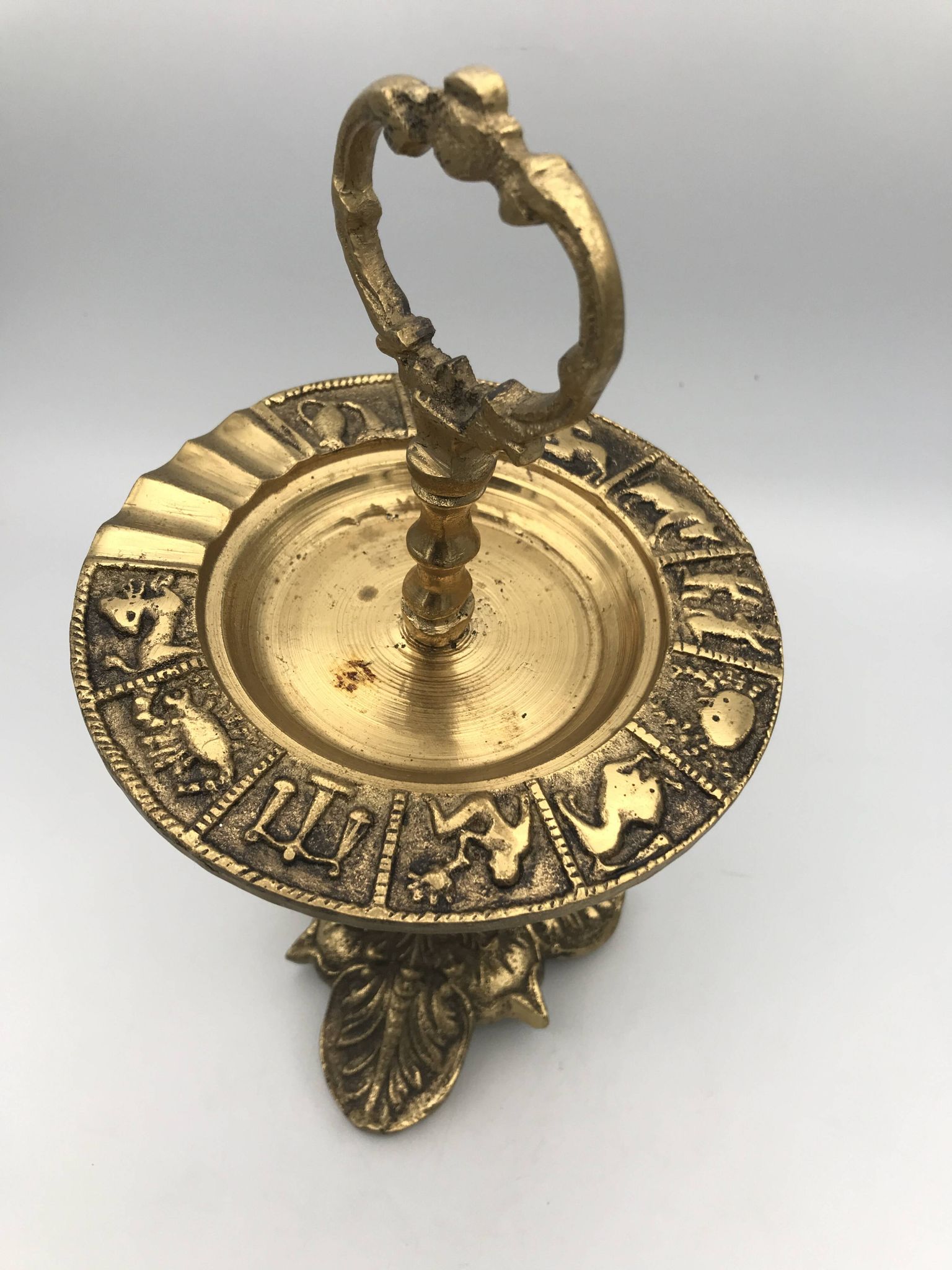 Vintage solid brass ashtray with zodiac sign decor