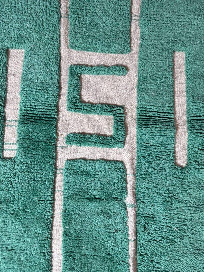 Beni Ourain Berber rug made of natural wool, traditionally handwoven.