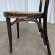 Chaise de salle à manger vintage style Thonet en bois noir et assise en cannage 1970