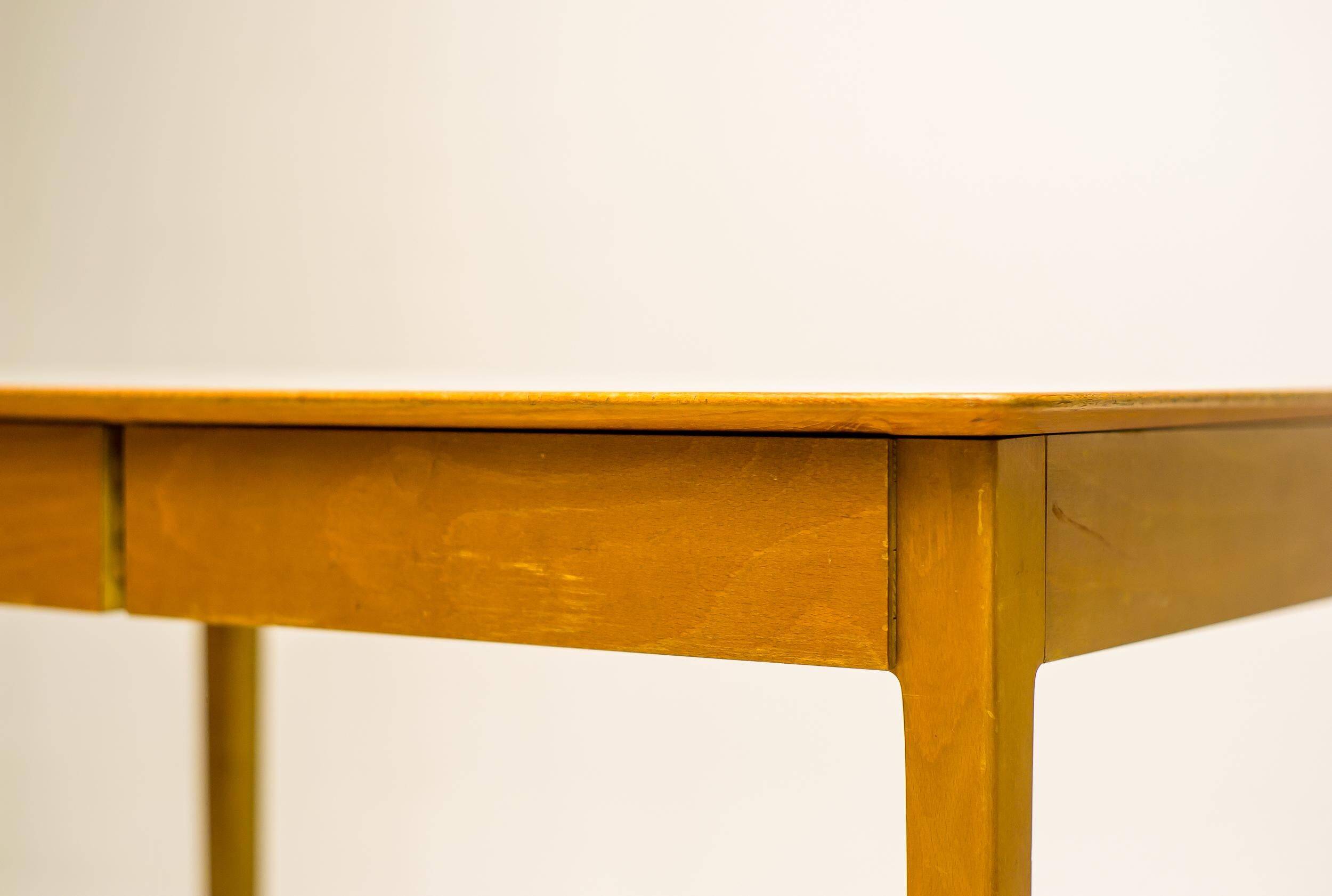 Small maple desk with a laminate top and two drawers, Fritz Hansen, 1950s.