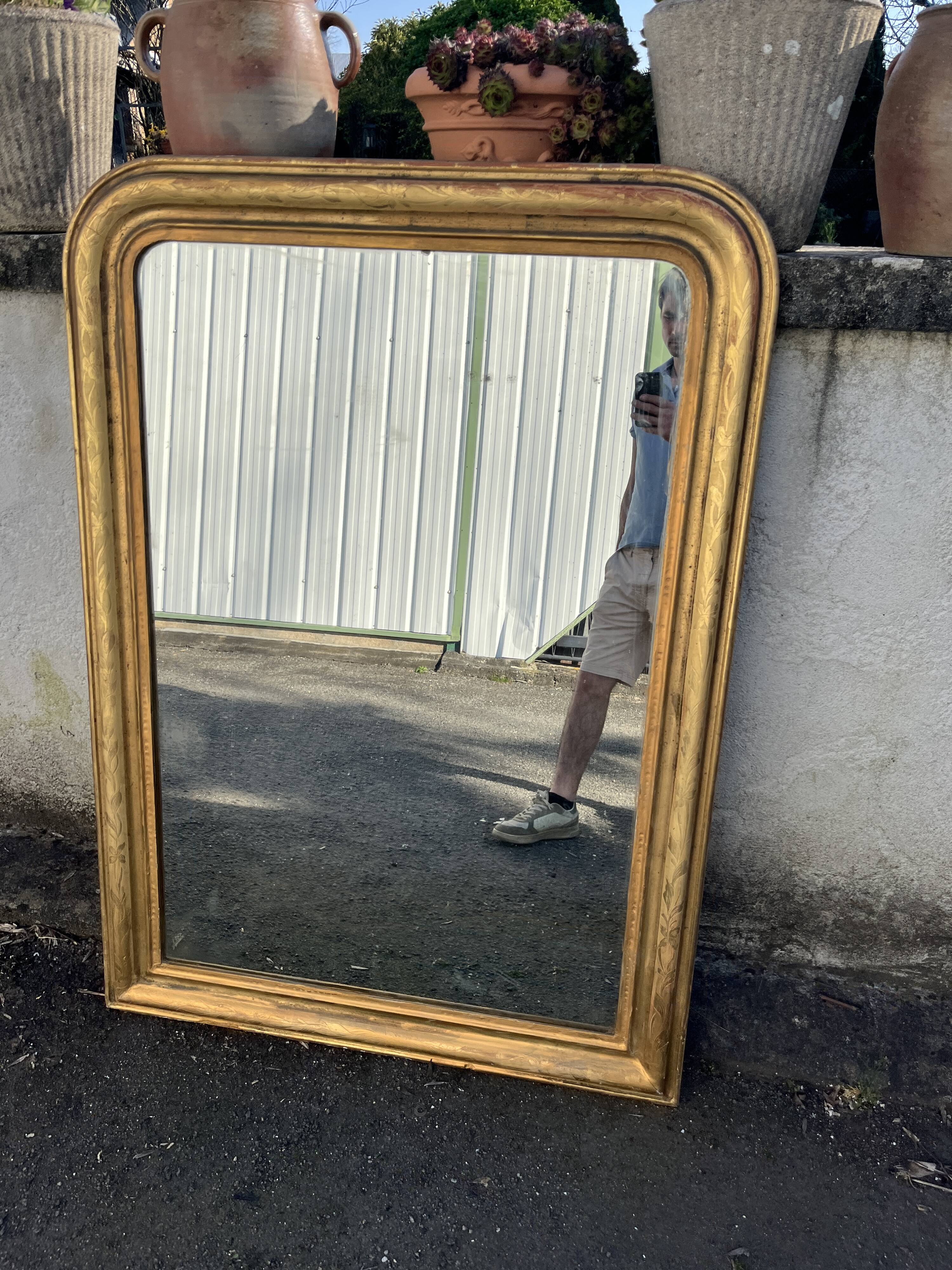 Large Louis-Philippe gilded mirror with gold leaf