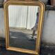 Large Louis-Philippe gilded mirror with gold leaf