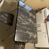 Table and 4 chairs in Formica.