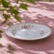 Round plate from the 19th century, pink ironstone, signed Maestricht "Toulouse"