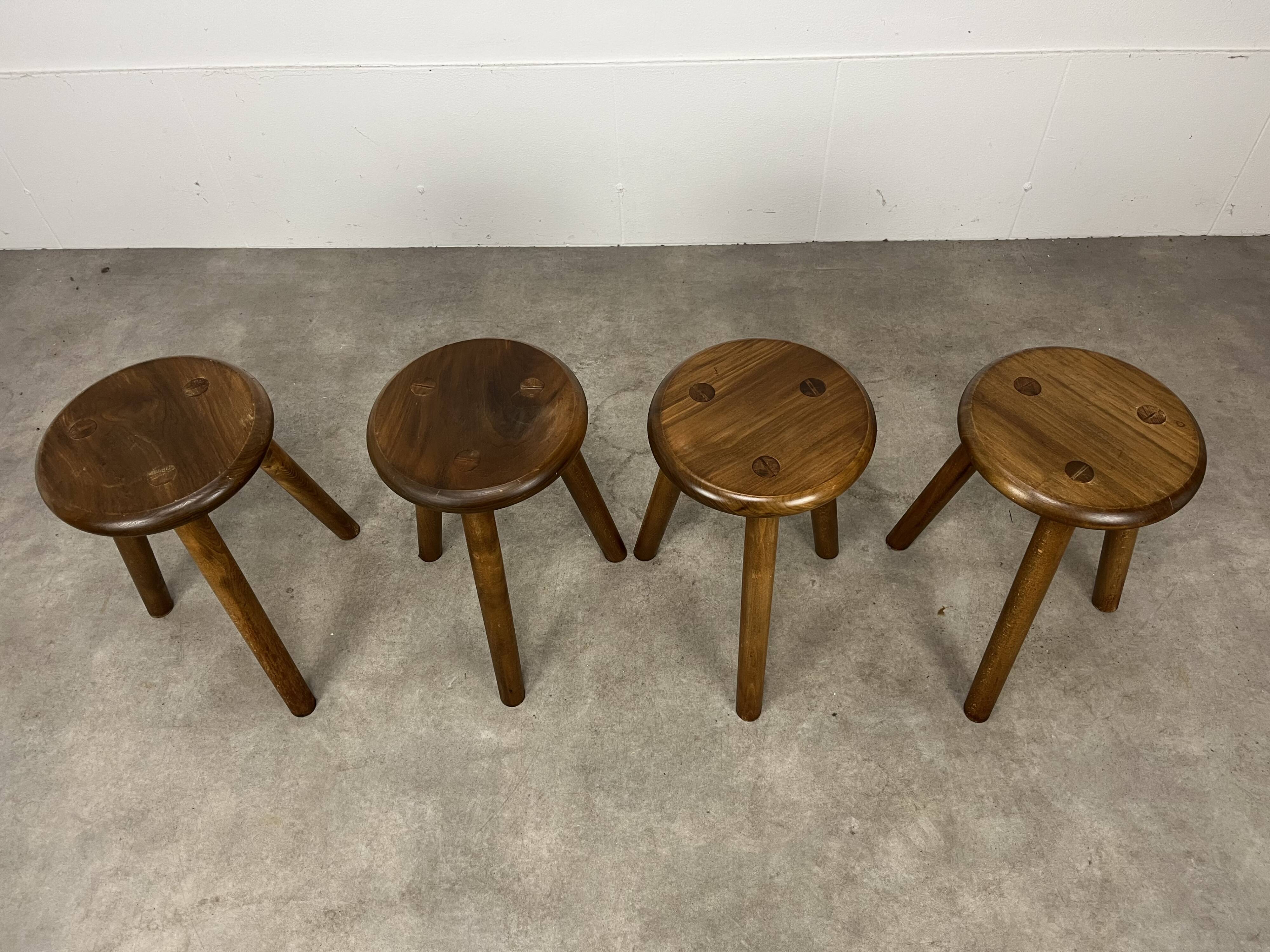 4 wooden tripod stools