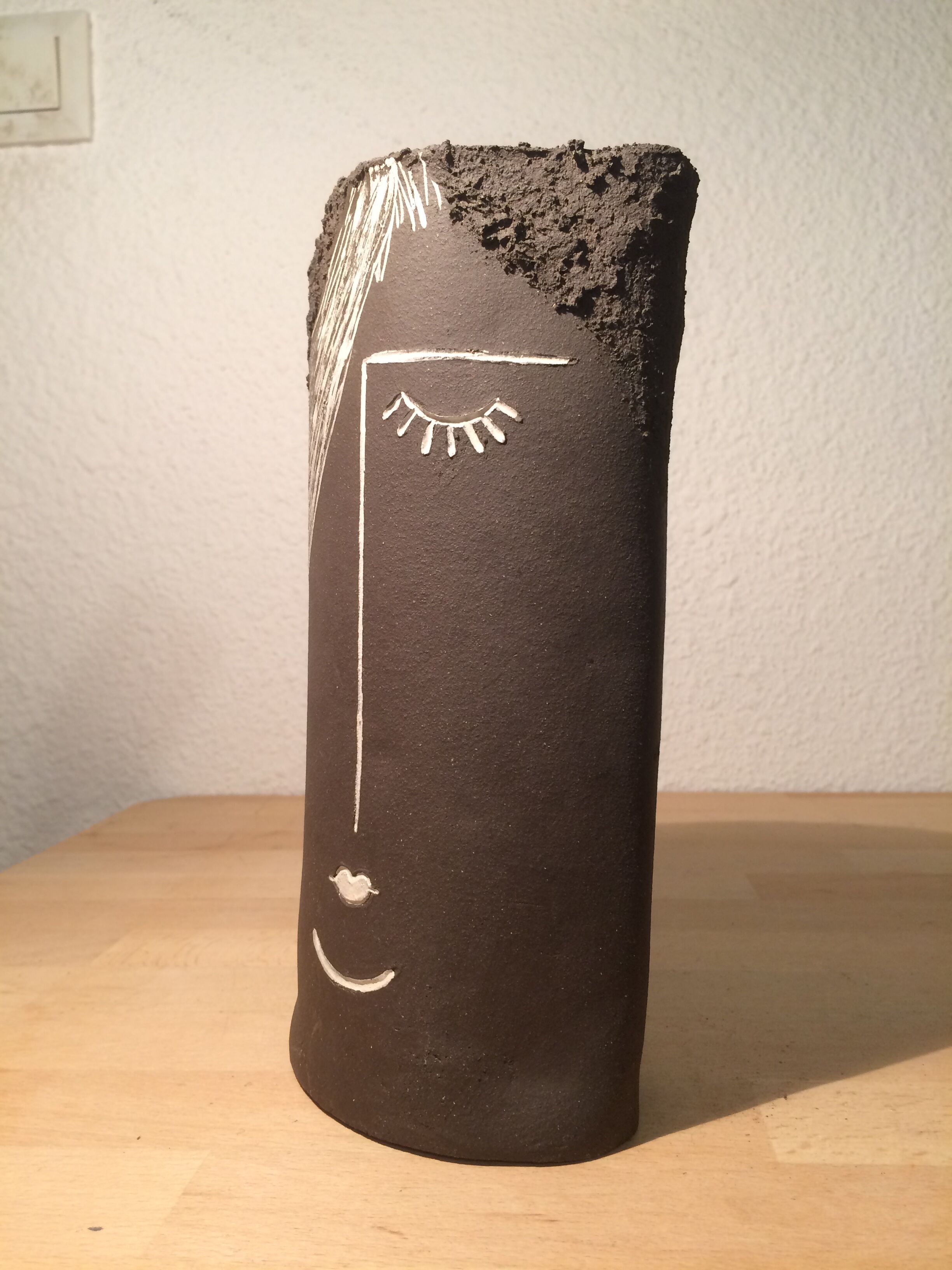 Ceramic vase face, black and white