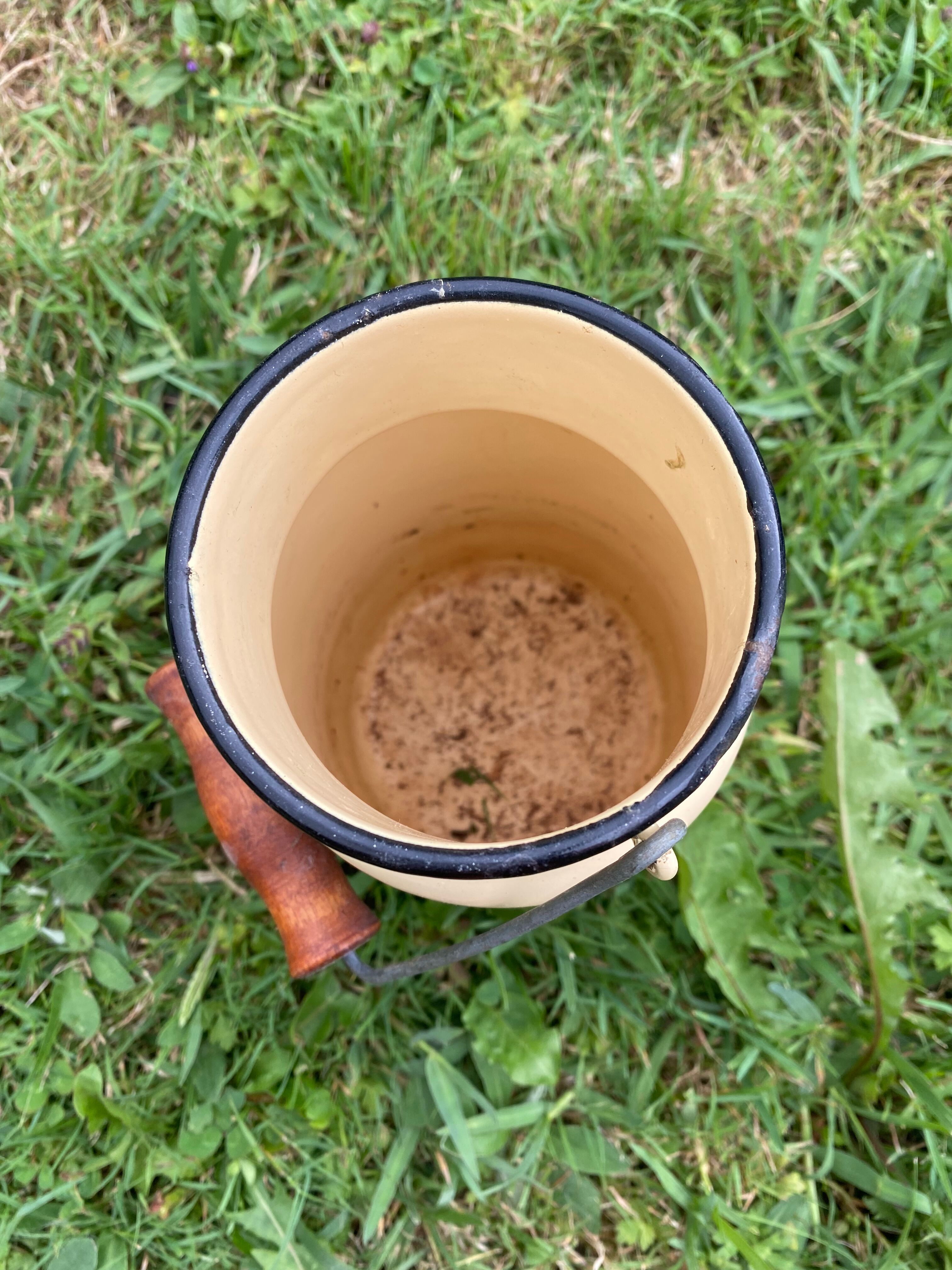 Old milk pot in enamelled sheet metal