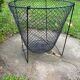 Foldable black woven metal wastepaper basket from around 1950.