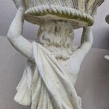 Antique reconstituted stone planter depicting a cherub