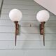 Pair of Art Deco wall sconces in brass and white opaline, 1930.