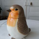 Covered jar jar jar in the shape of a bird