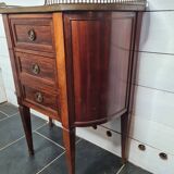 curved mahogany chest of drawers with marble top