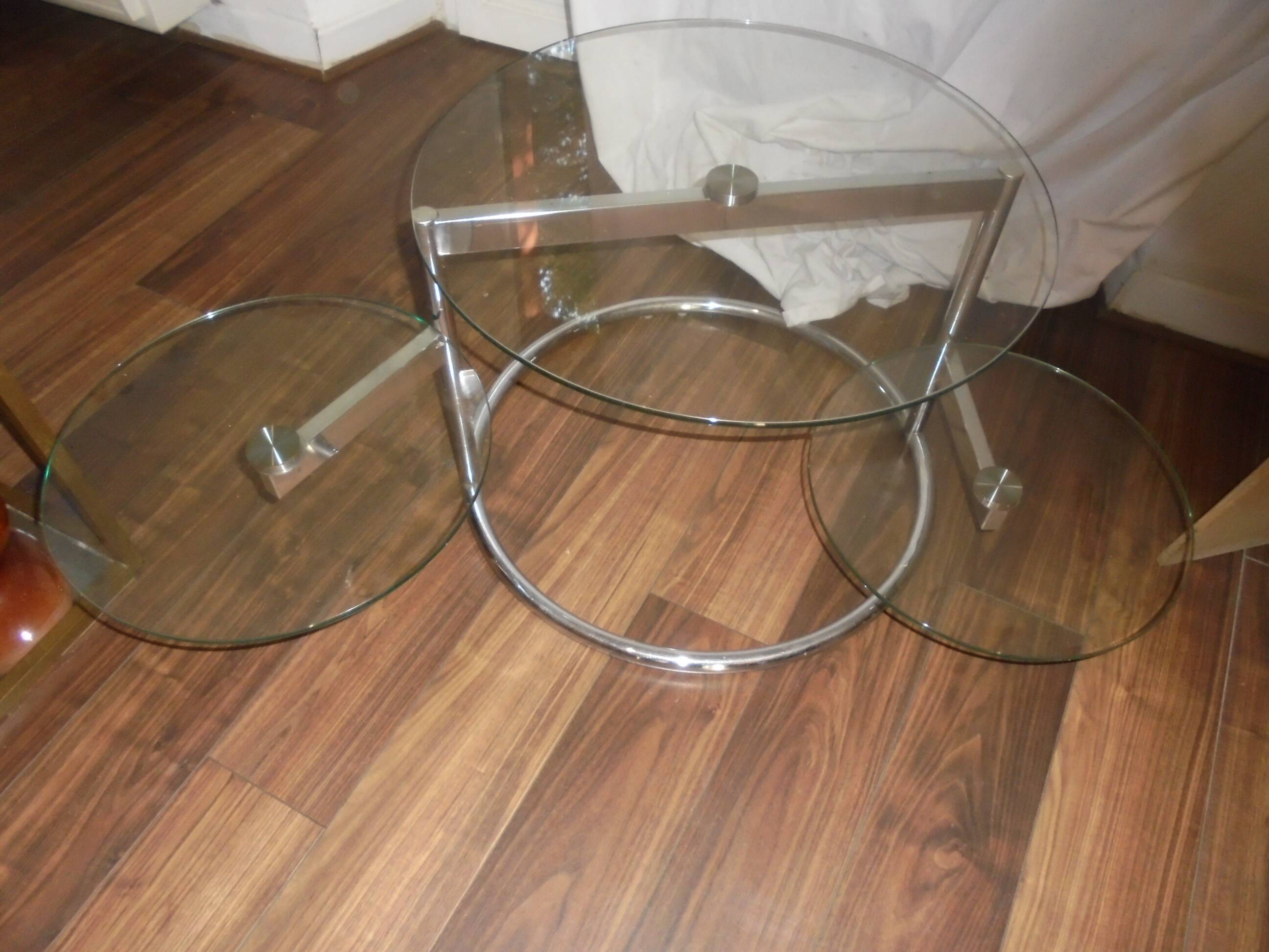 Glass coffee table with swivel tops circa 1980