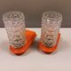 Bathroom lamps in a nice orange colour with a crystal glass shade and a base of hard thin plastic