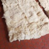 Beige goatskin rug in pair
