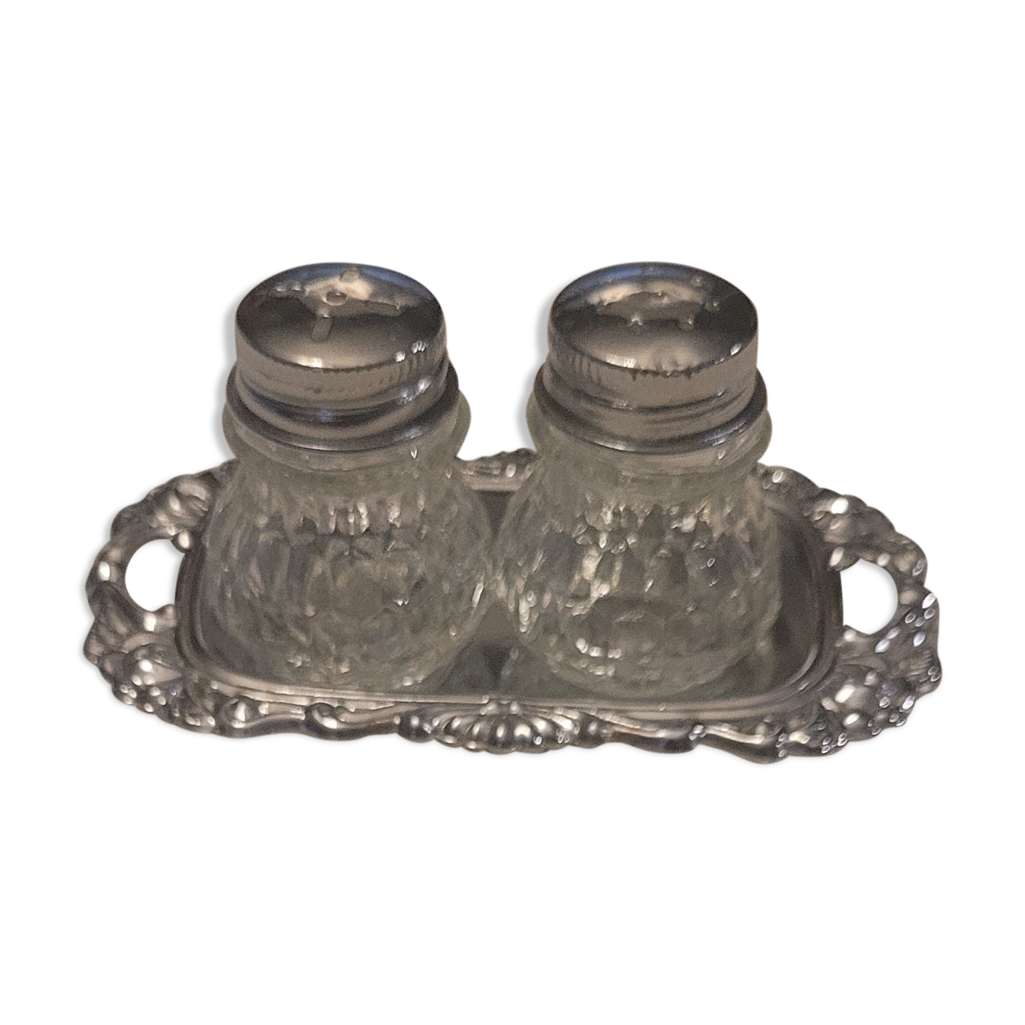 Salt and pepper and silver tray