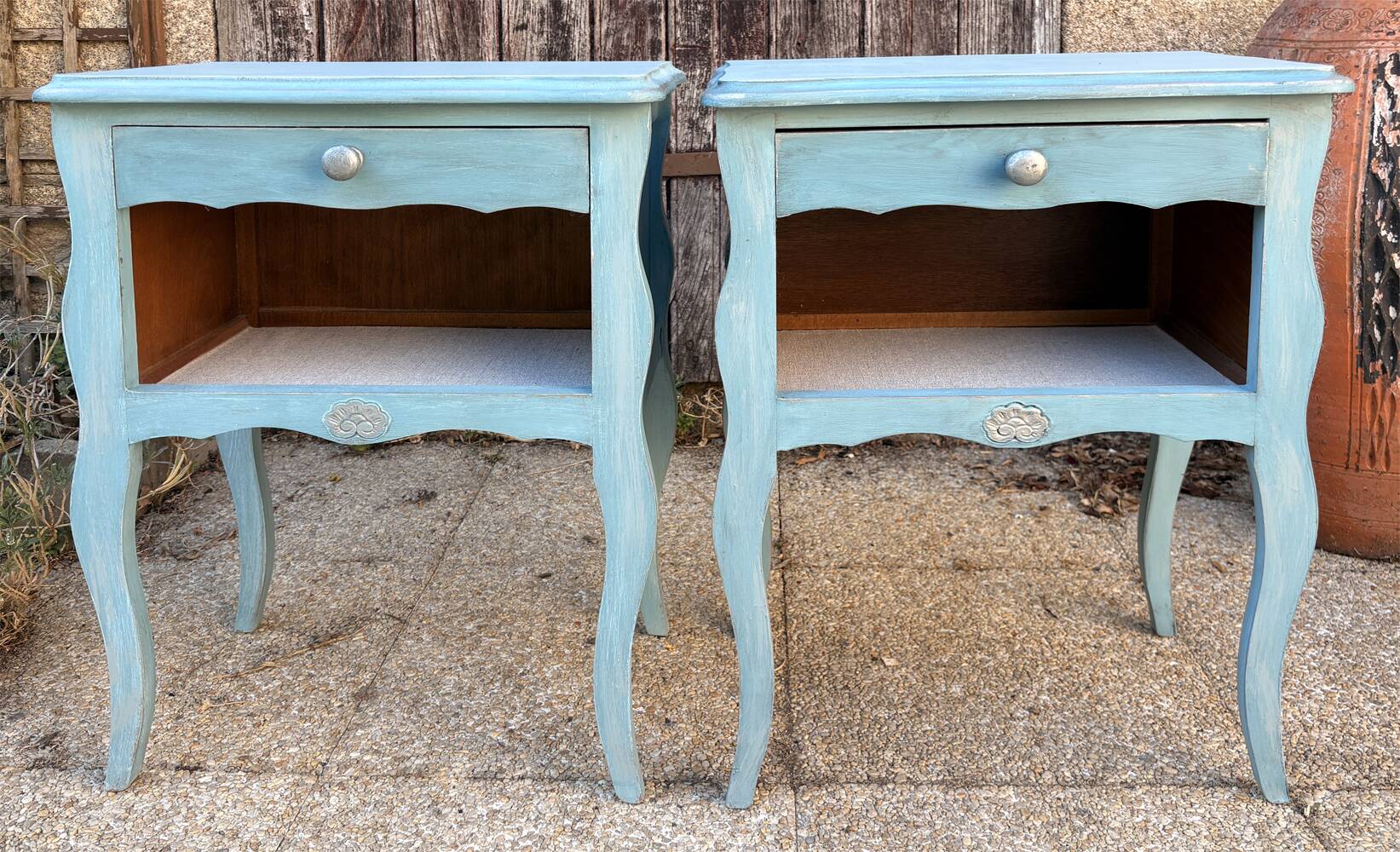 Pair of patinated lagoon blue bedside tables, early 20th century, with curved legs.