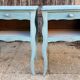 Pair of patinated lagoon blue bedside tables, early 20th century, with curved legs.