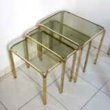 Series of nesting tables in smoked glass & rectangular golden brass