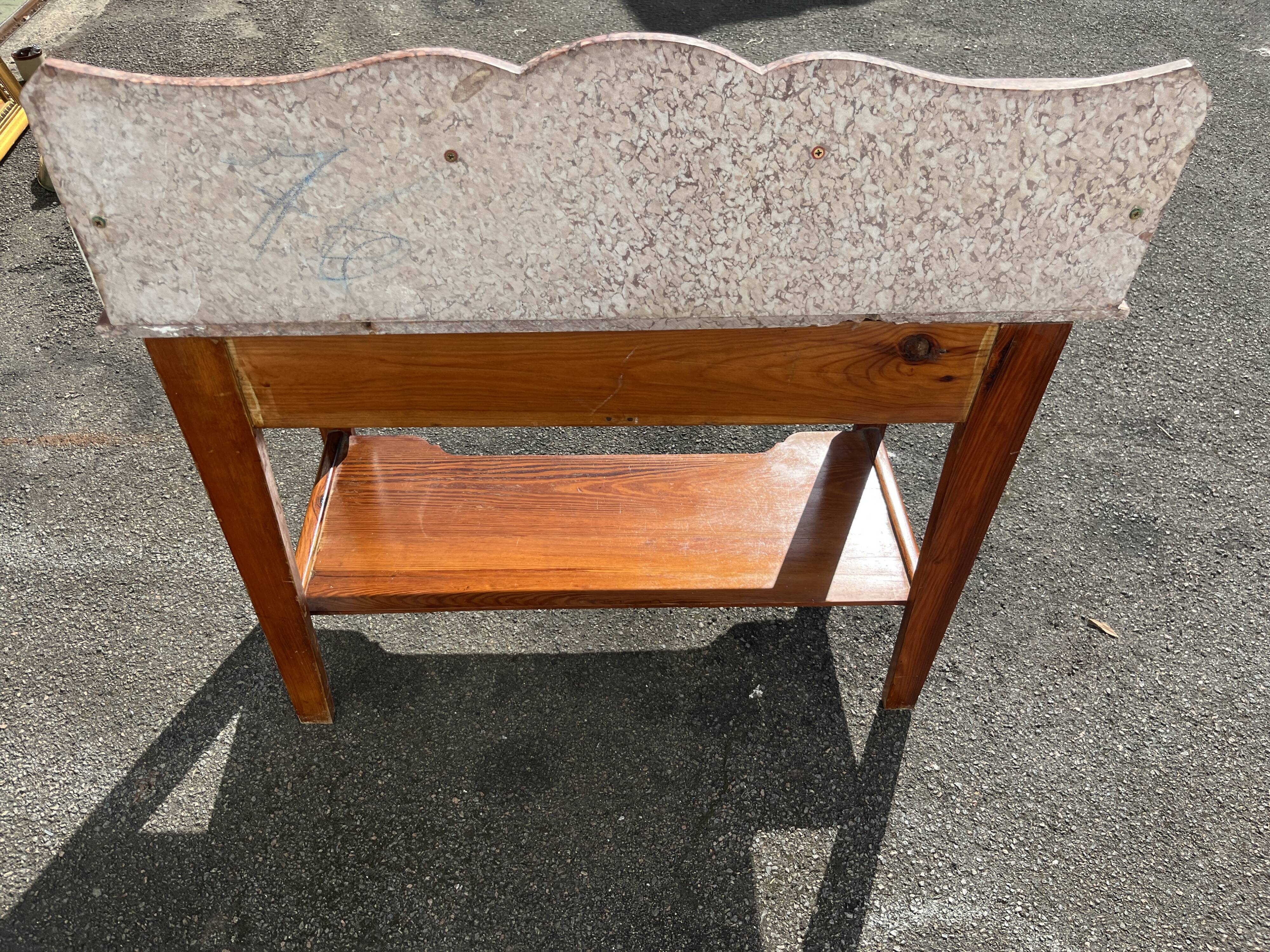 Antique wooden and red marble bathroom cabinet