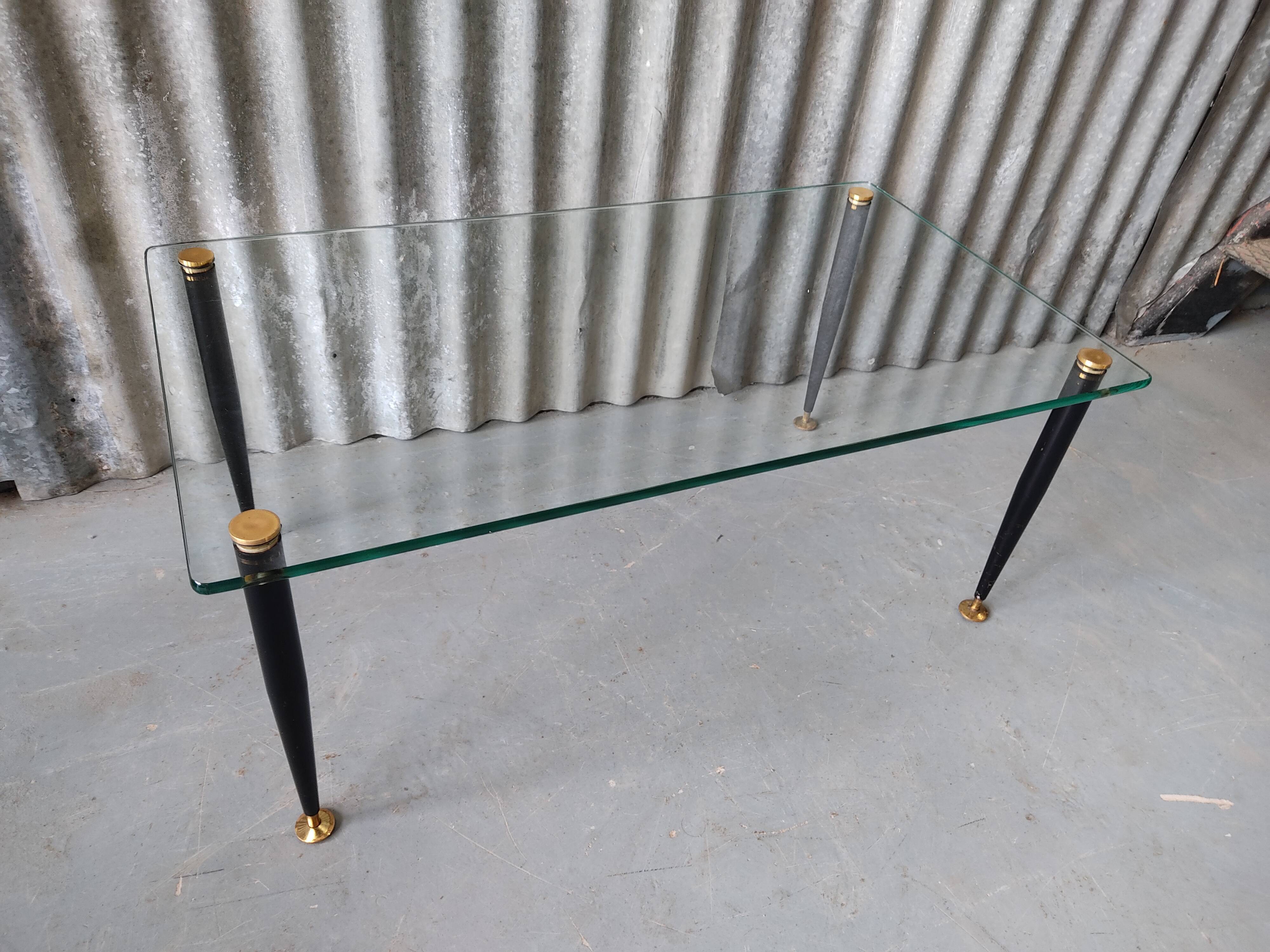Glass and black metal coffee table