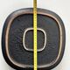 Large decorative ceramic catchall with red and black spiral pattern.