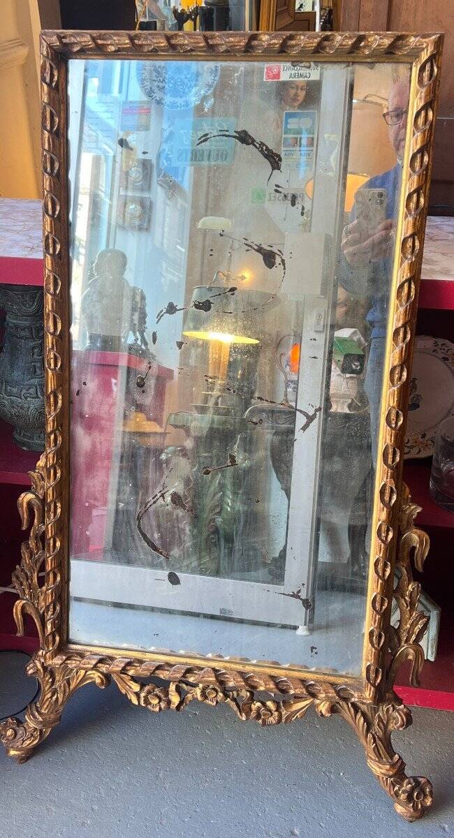 Antique mirror above a chest of drawers or between two windows, carved wood, 18th century