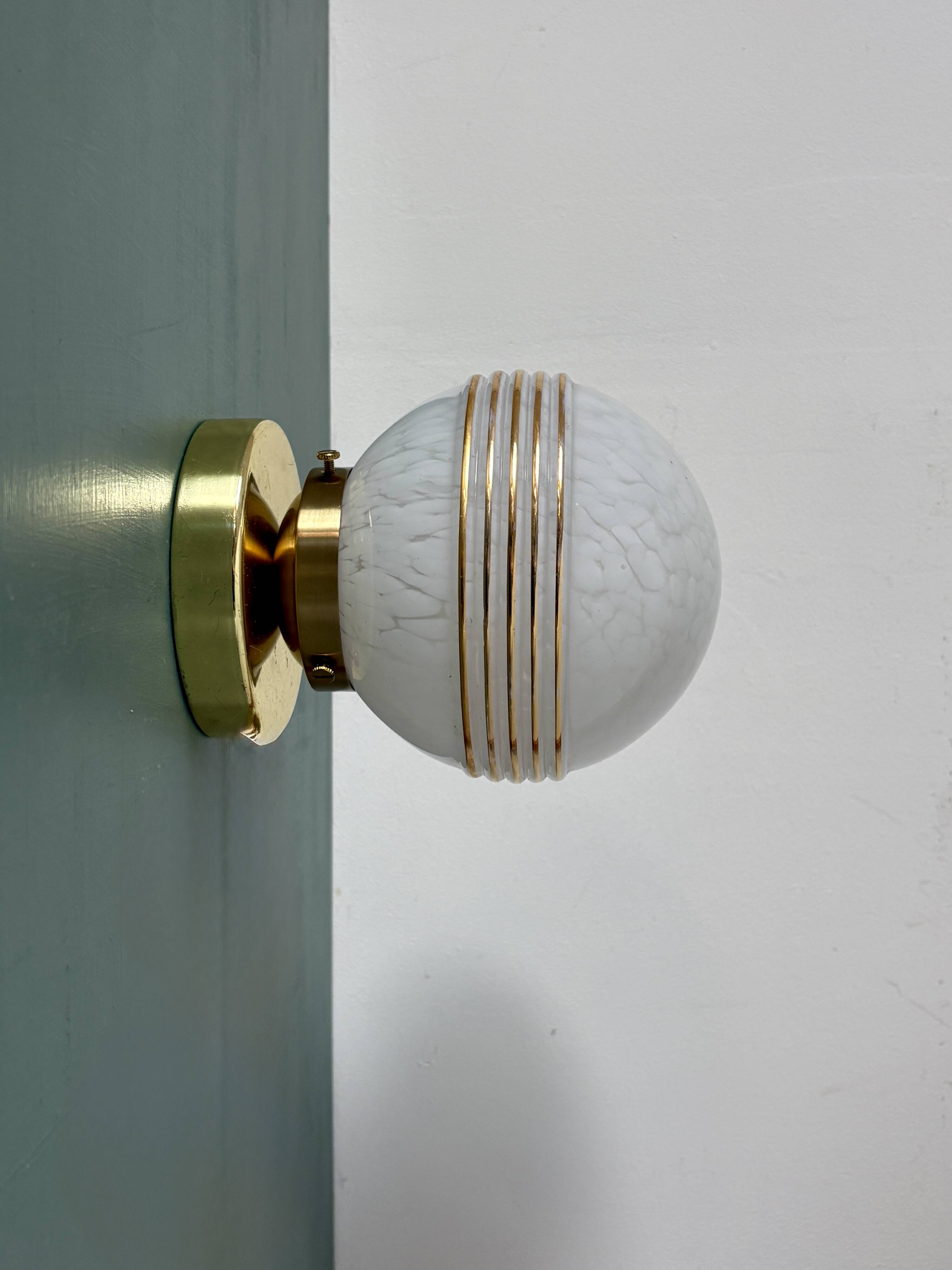 Vintage glass globe wall or ceiling light in white and gold from Clichy.