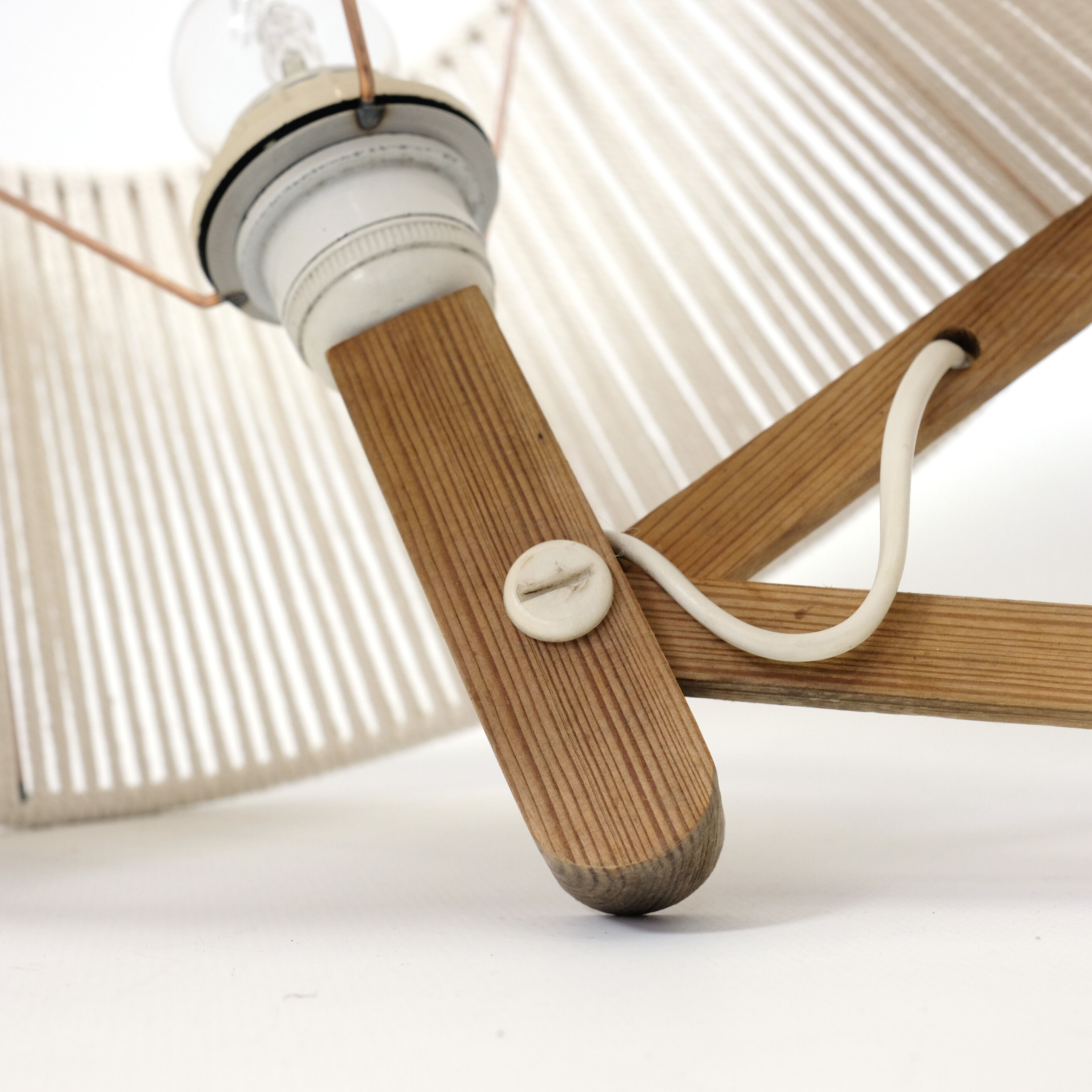 Pair of pine accordion sconces with cotton rope lampshade.